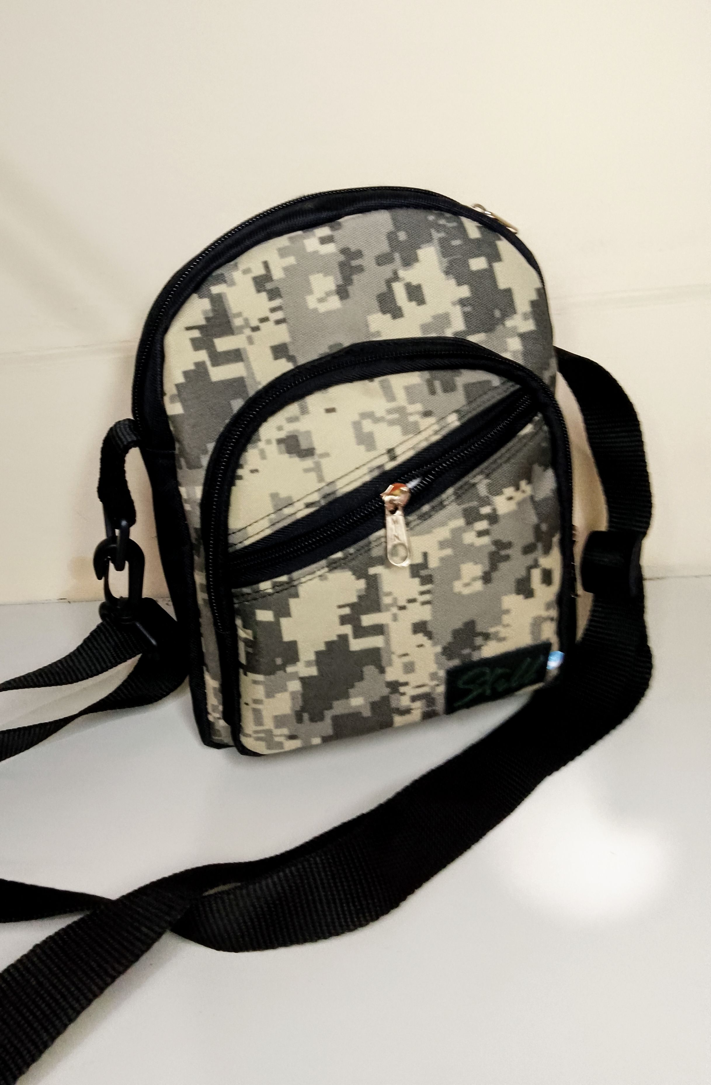 bandolera cámara hombre