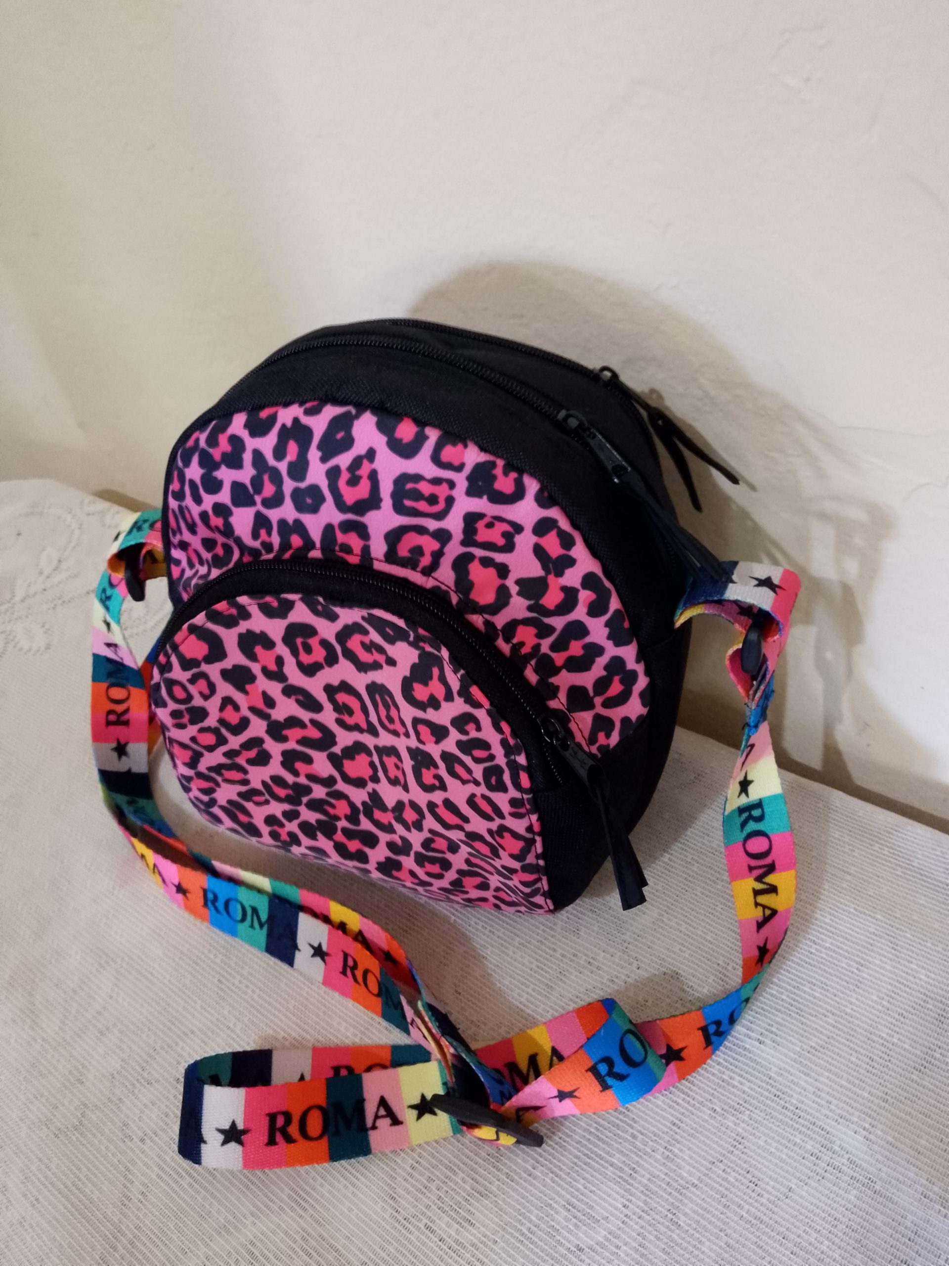 bandolera circular print rosa